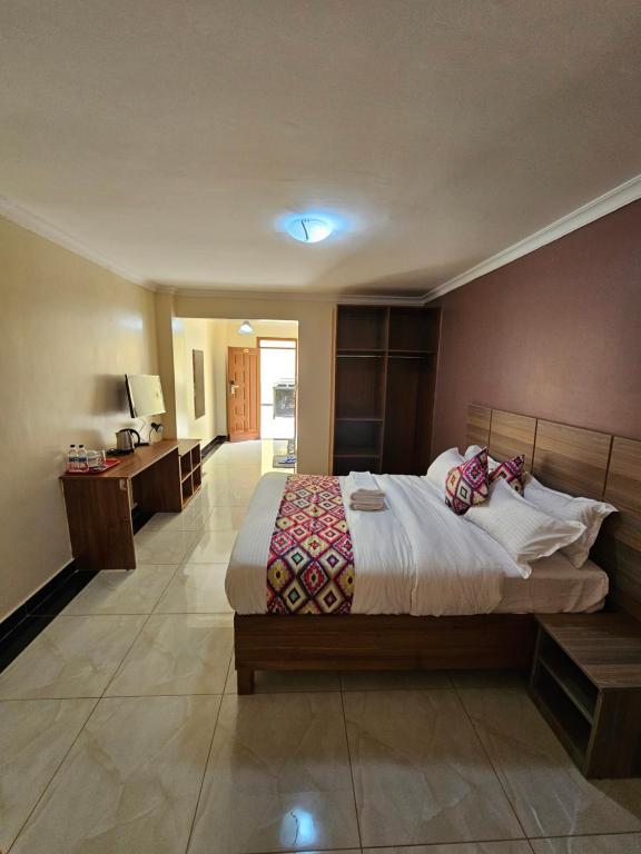 Postel nebo postele na pokoji v ubytování Big Tusks Hotel, Marsabit