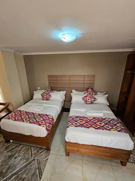 Postel nebo postele na pokoji v ubytování Big Tusks Hotel, Marsabit