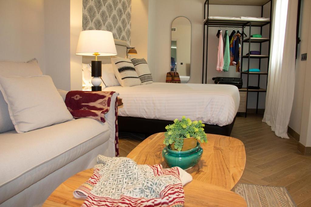 Postel nebo postele na pokoji v ubytování Puerta de la Ribera Suites