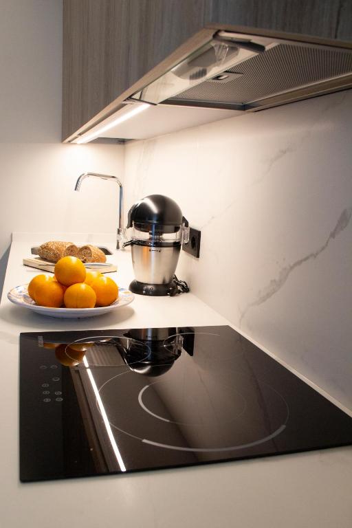 Kuchyň nebo kuchyňský kout v ubytování Puerta de la Ribera Suites
