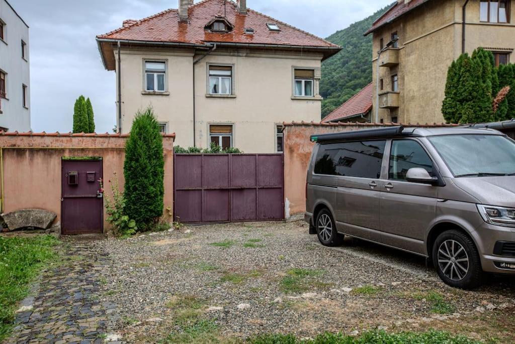 a van parked in front of a house at GB4 by Rentable in Braşov