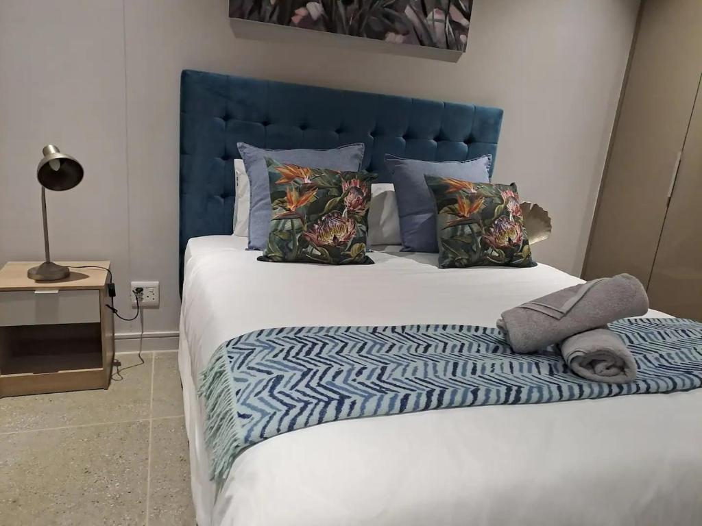 Ένα ή περισσότερα κρεβάτια σε δωμάτιο στο Unit 208 Zimbali Boulevard Edge