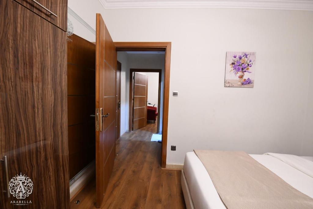 Postel nebo postele na pokoji v ubytování Arabella Residence