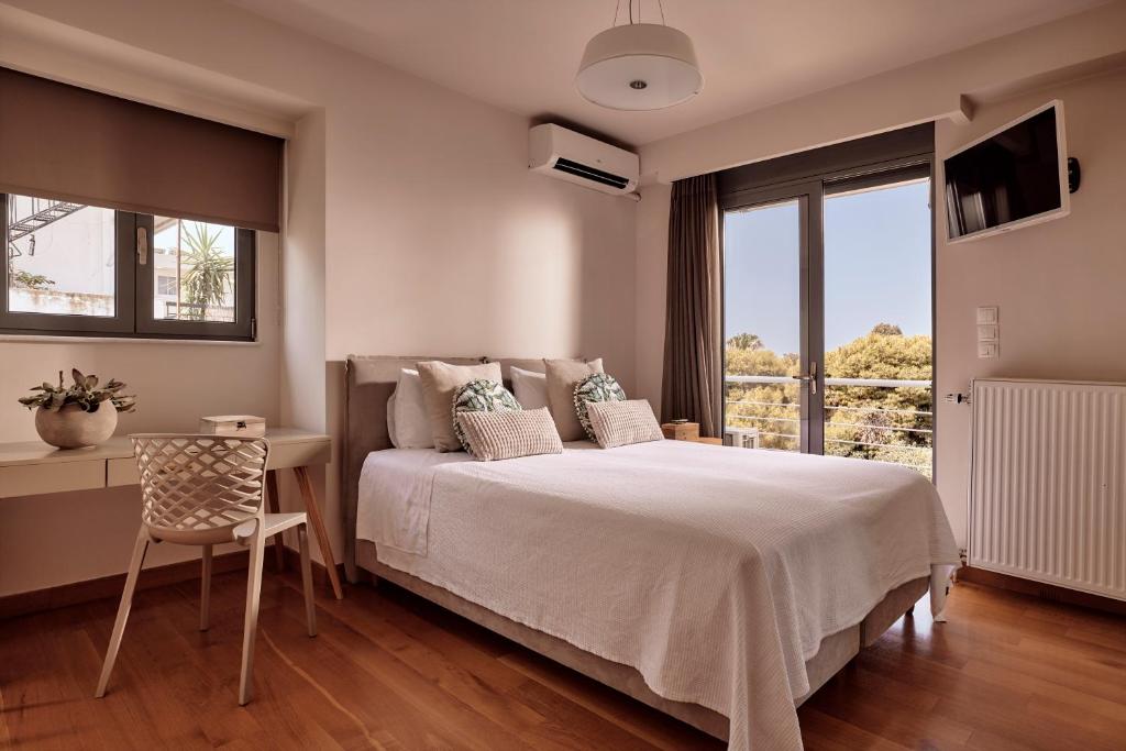 Posteľ alebo postele v izbe v ubytovaní Elaia Luxury Condo Glyfada