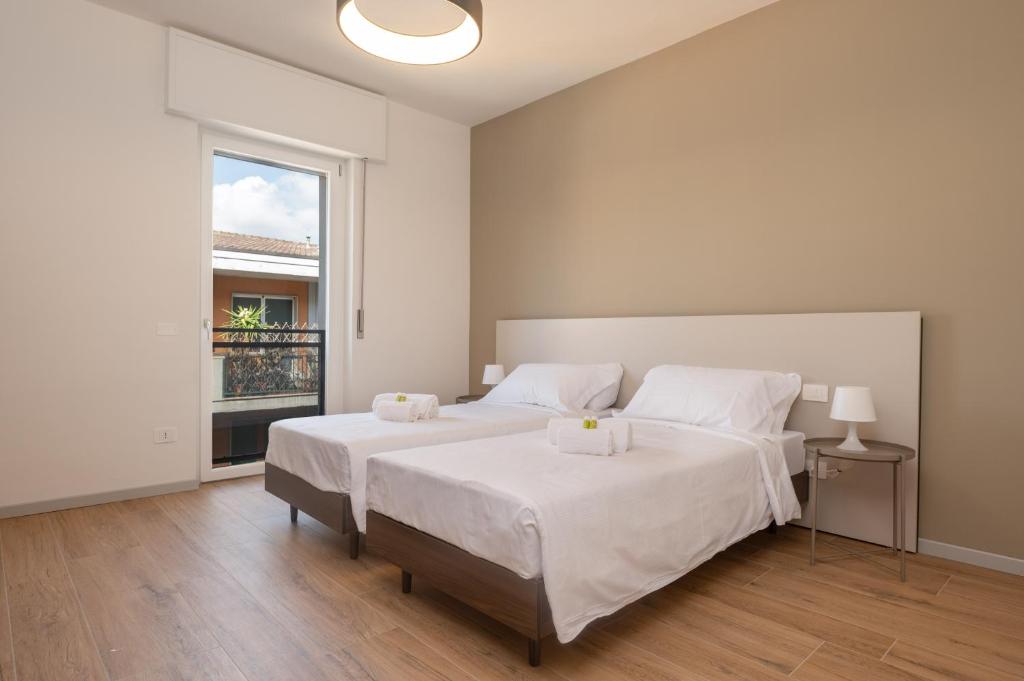 Ένα ή περισσότερα κρεβάτια σε δωμάτιο στο MuBra 55 Apartments