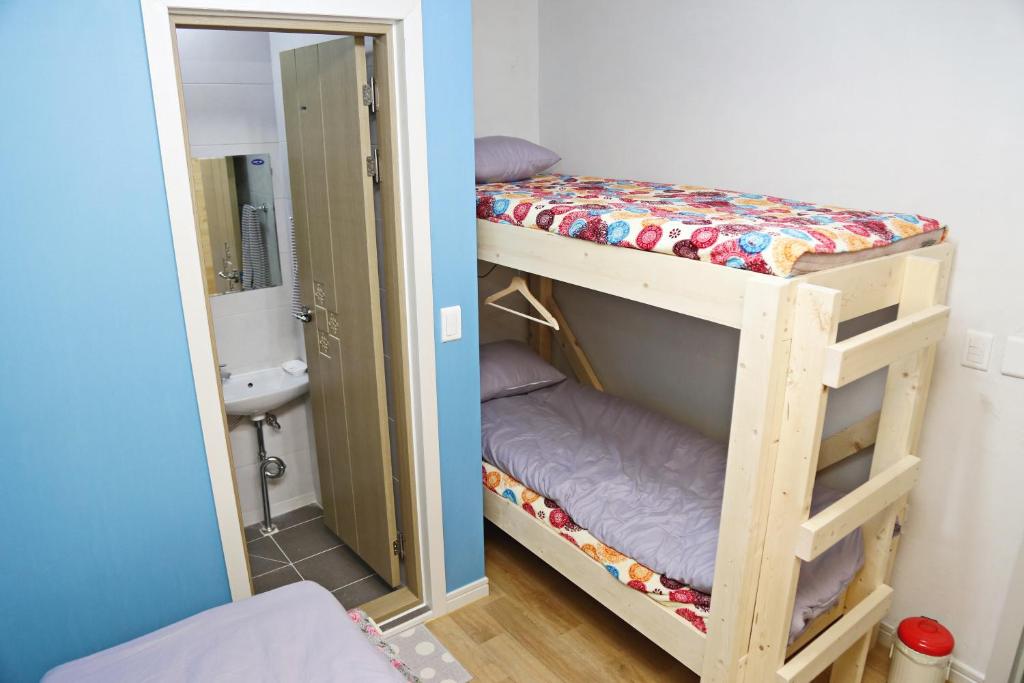 Postel nebo postele na pokoji v ubytování OP 102 Guesthouse