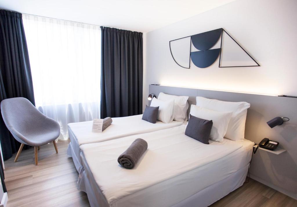 Postel nebo postele na pokoji v ubytování Coral Suites & Spa - Adults Only