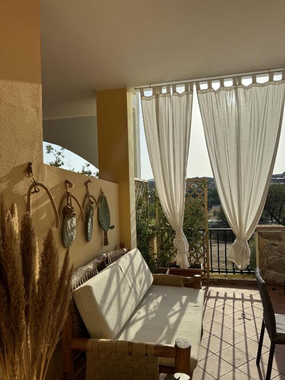 A balcony or terrace at Dimora Pintau in residence con piscina privata