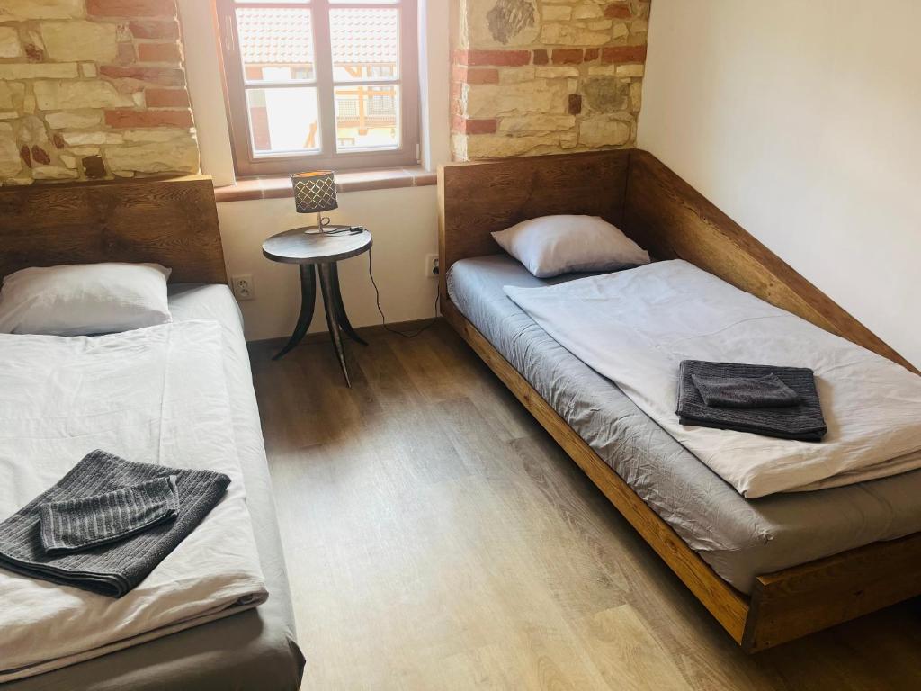 Postel nebo postele na pokoji v ubytování Penzion Kopanský mlýn