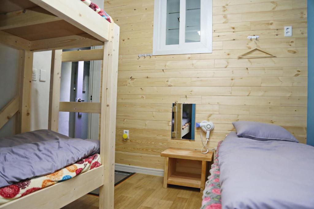 Postel nebo postele na pokoji v ubytování OP 102 Guesthouse