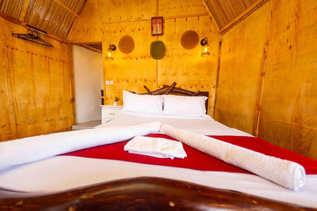 Postel nebo postele na pokoji v ubytování Olemayian Amboseli Cottages