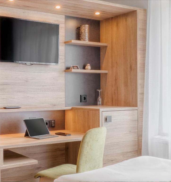 TV a/nebo společenská místnost v ubytování Hotel Schultheiss Hameln