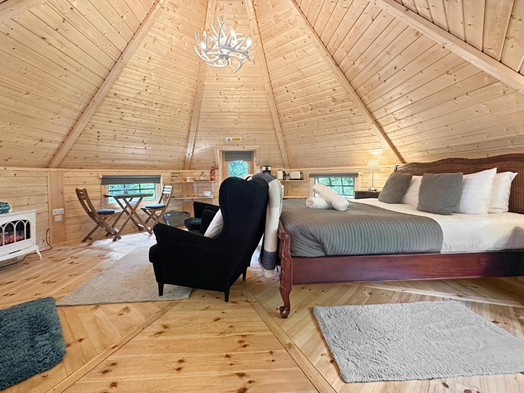 Postel nebo postele na pokoji v ubytování Aos Sí Lodges