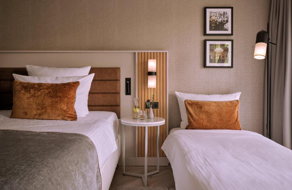 Postel nebo postele na pokoji v ubytování Leonardo Royal Hotel Baden- Baden
