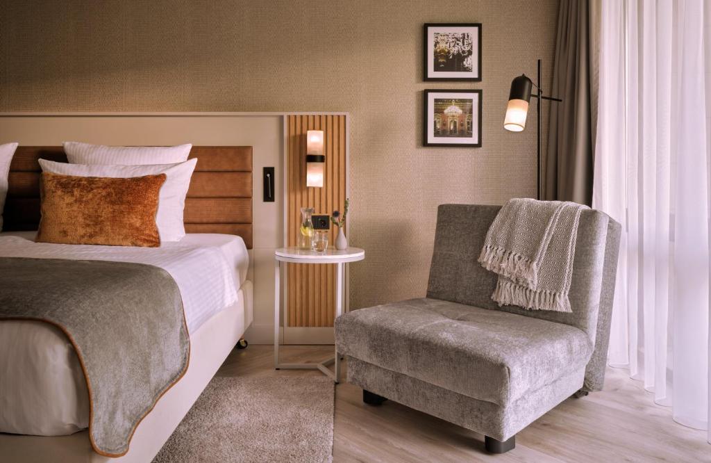 Postel nebo postele na pokoji v ubytování Leonardo Royal Hotel Baden- Baden