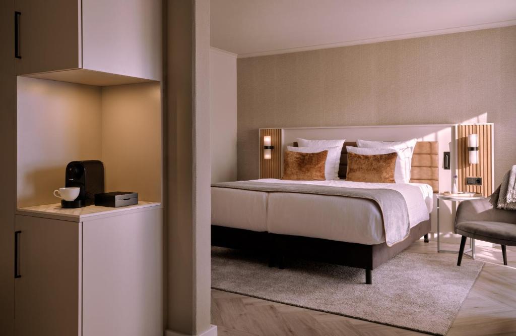 Postel nebo postele na pokoji v ubytování Leonardo Royal Hotel Baden- Baden