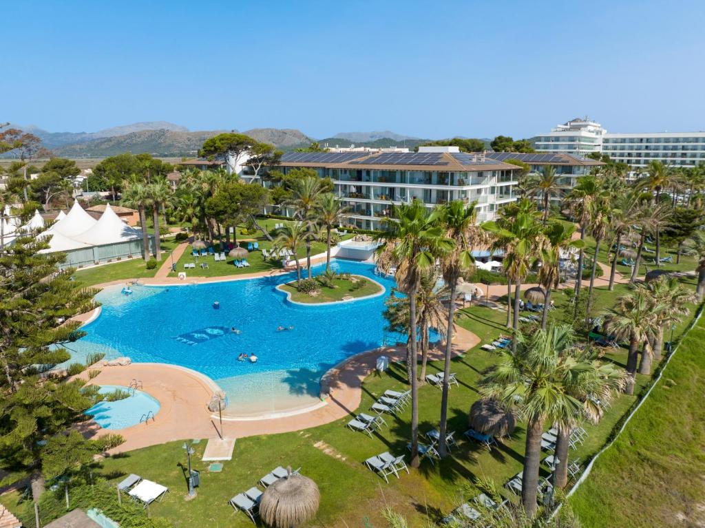 an aerial view of a pool at a resort at Playa Esperanza Resort Affiliated by Meliá in Playa de Muro