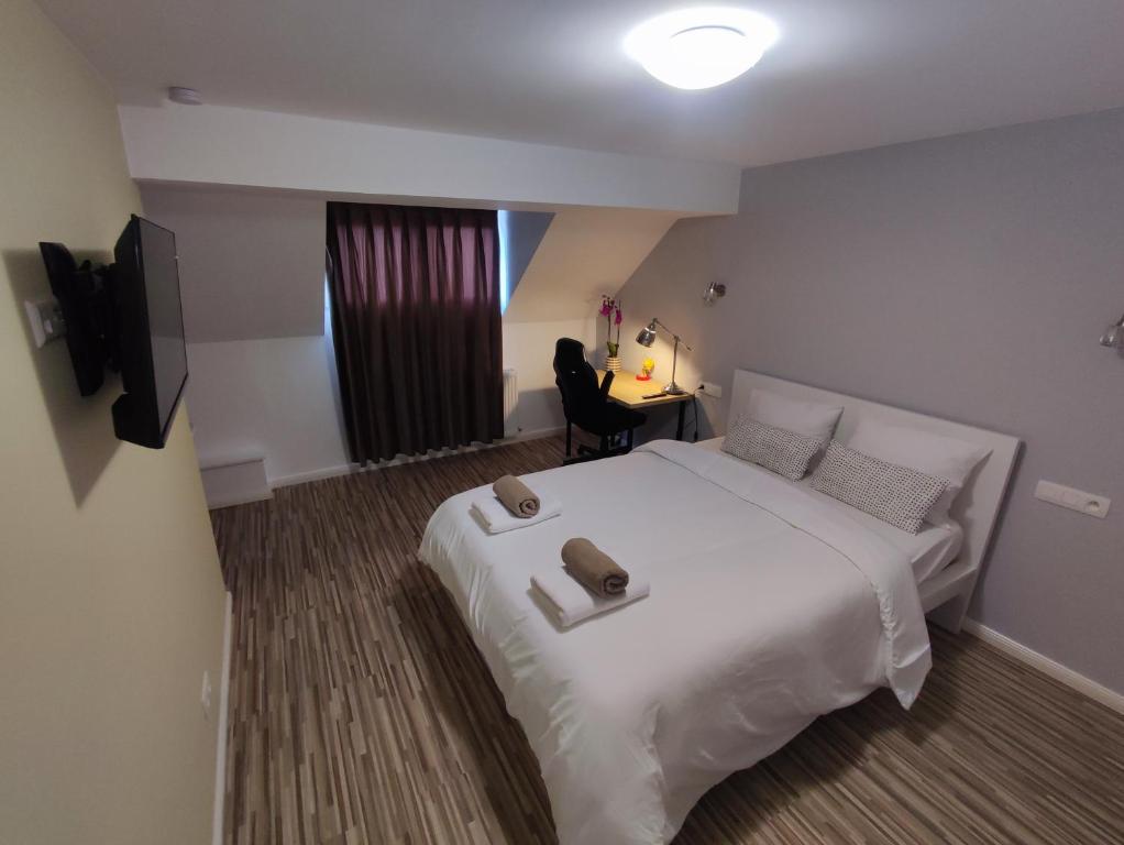 Lova arba lovos apgyvendinimo įstaigoje Arlon Guest House