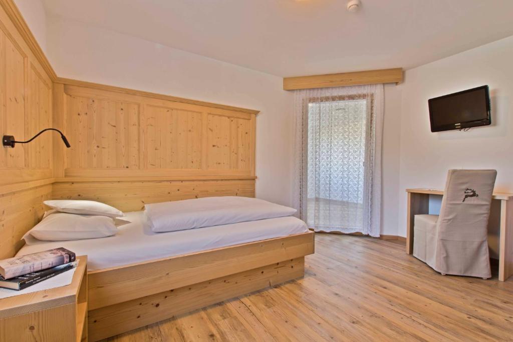 Postel nebo postele na pokoji v ubytování Hotel Steinrösl
