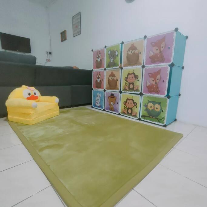 Postel nebo postele na pokoji v ubytování Taman Tinah Homestay