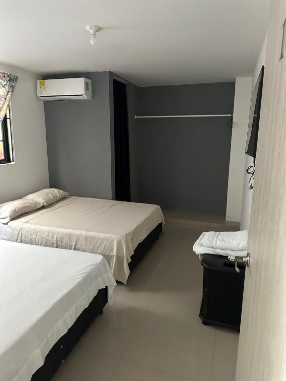 Postel nebo postele na pokoji v ubytování HOTEL IBIZA