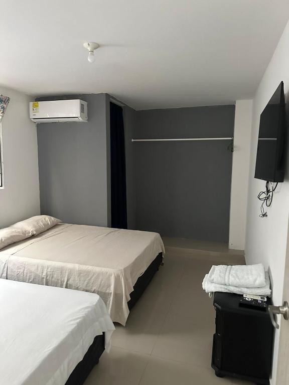 Postel nebo postele na pokoji v ubytování HOTEL IBIZA