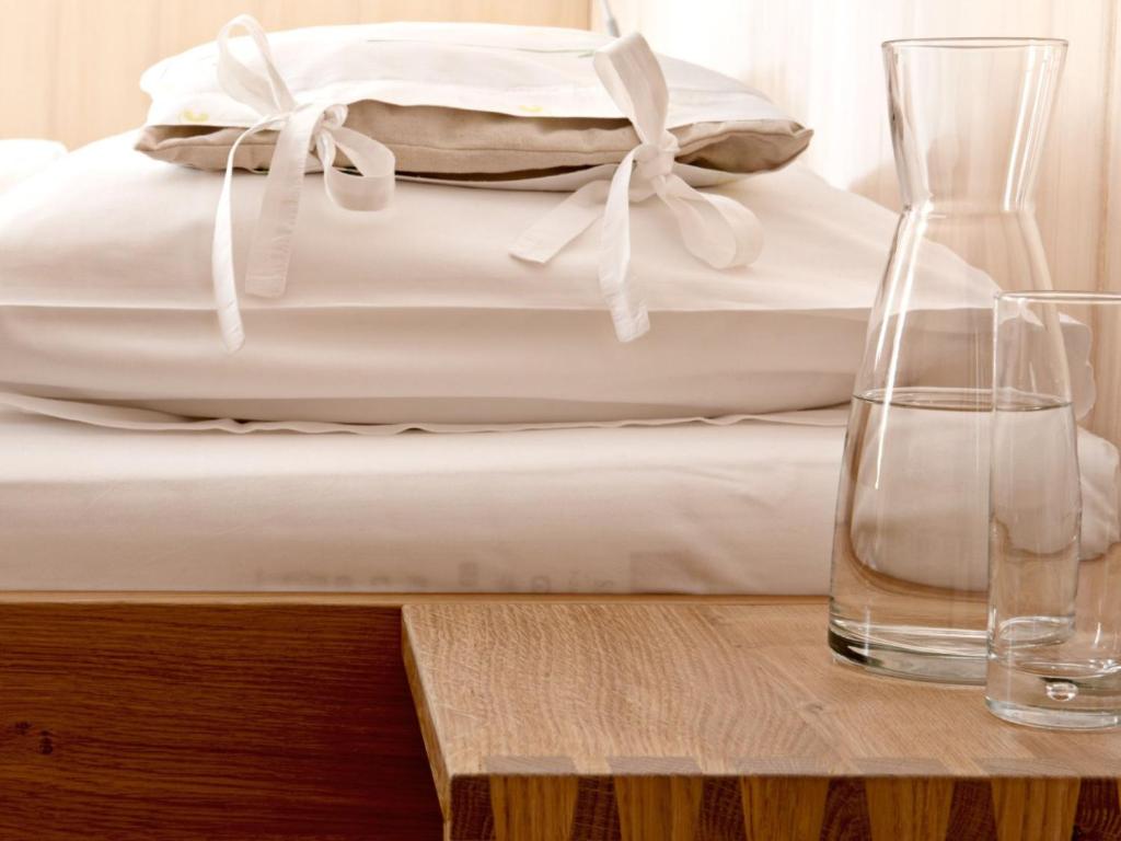 Postel nebo postele na pokoji v ubytování Biohotel Schwanen