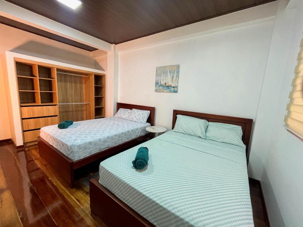Postel nebo postele na pokoji v ubytování Casa vacional de playa Santorini