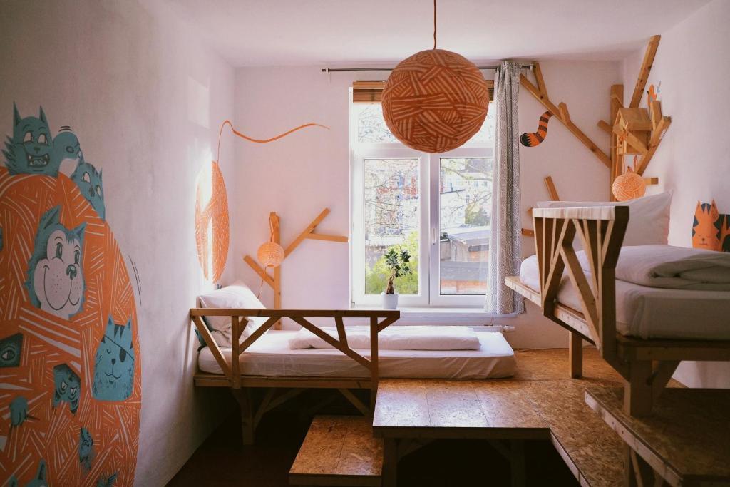 Postel nebo postele na pokoji v ubytování Hostel & Garten Eden