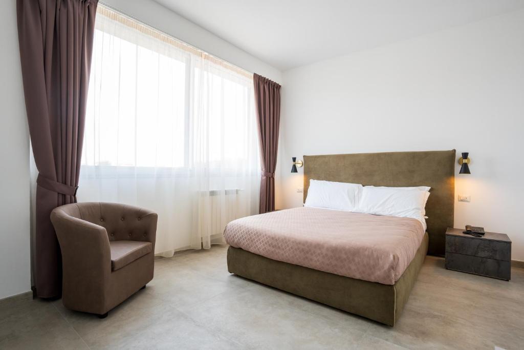 Postel nebo postele na pokoji v ubytování Hotel Bulà