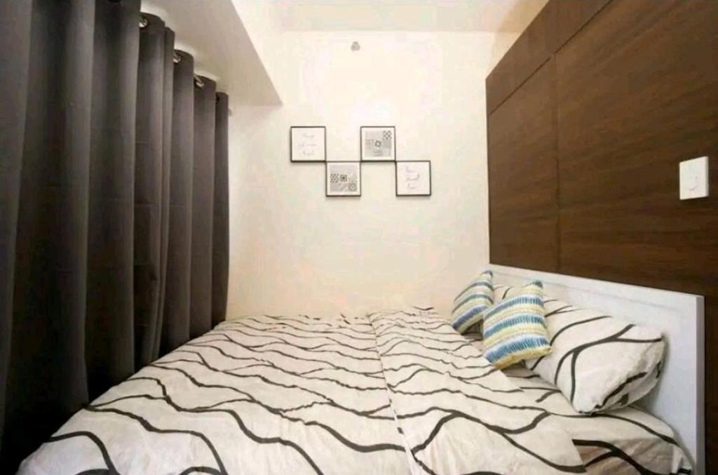 Postel nebo postele na pokoji v ubytování 1br at Air Makati Ayala near Makati med