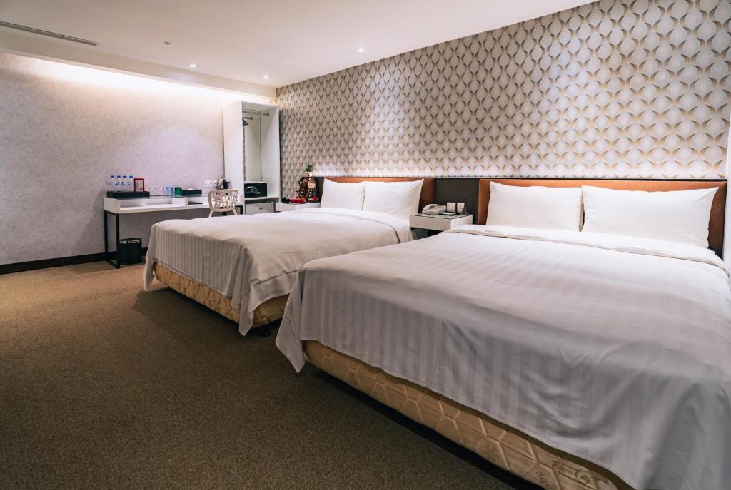 Ένα ή περισσότερα κρεβάτια σε δωμάτιο στο Hotel Puri Taipei Station Branch