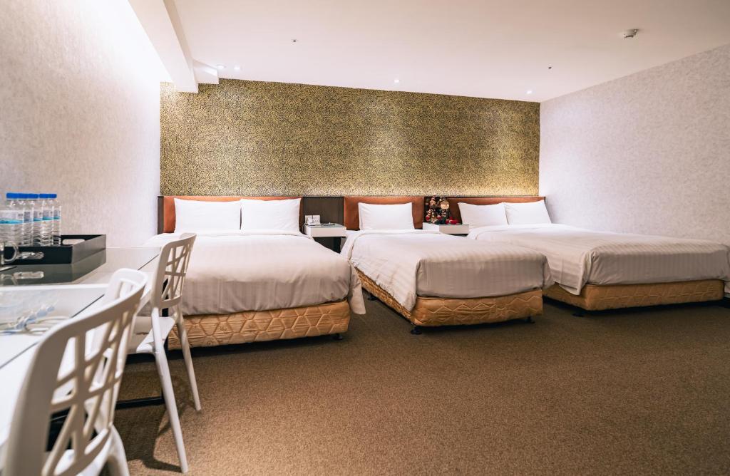 Ένα ή περισσότερα κρεβάτια σε δωμάτιο στο Hotel Puri Taipei Station Branch