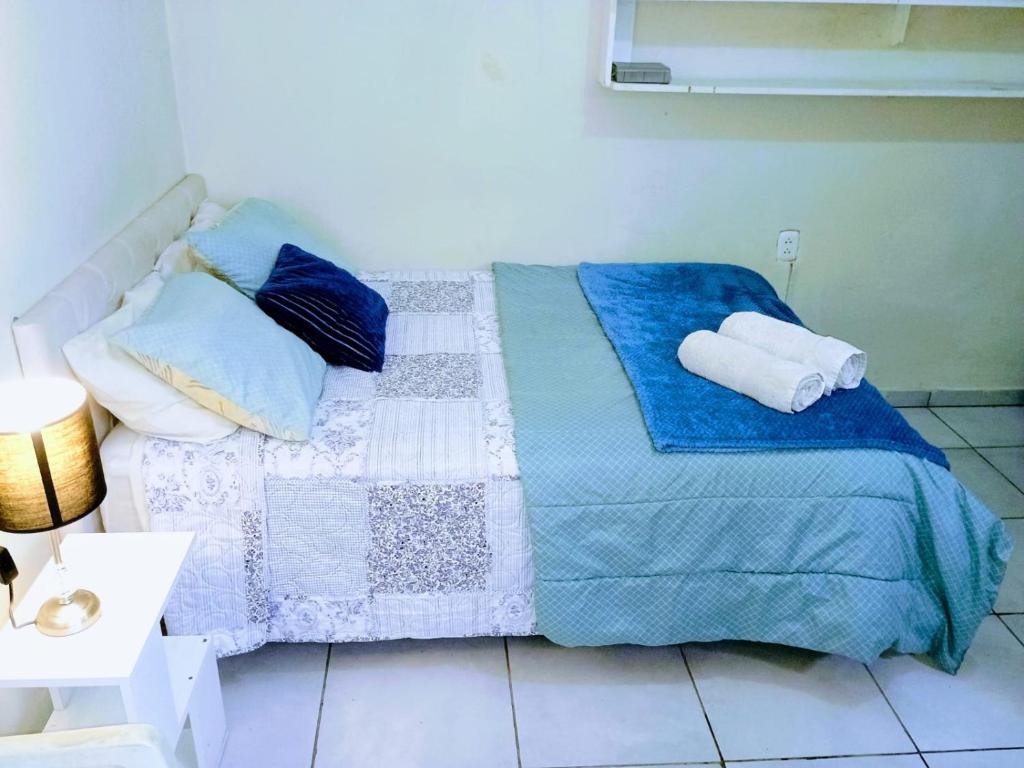 Postel nebo postele na pokoji v ubytování Tacna Guest House