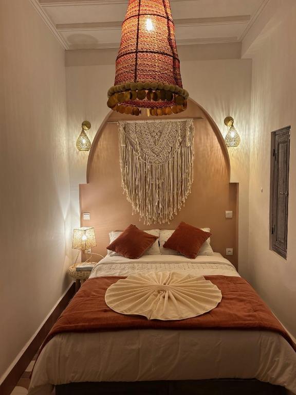 Postel nebo postele na pokoji v ubytování Riad Be Colors