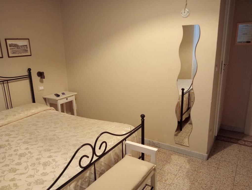 Postel nebo postele na pokoji v ubytování Buonanotte Rooms