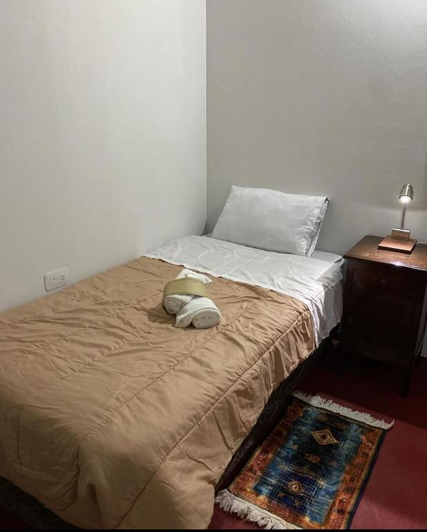Postel nebo postele na pokoji v ubytování Intiquilla Hostel