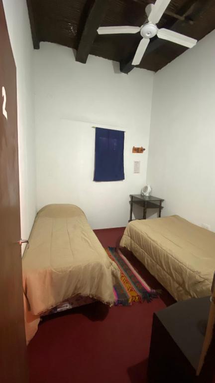 Postel nebo postele na pokoji v ubytování Intiquilla Hostel