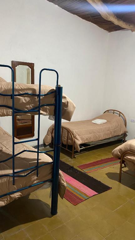 Postel nebo postele na pokoji v ubytování Intiquilla Hostel