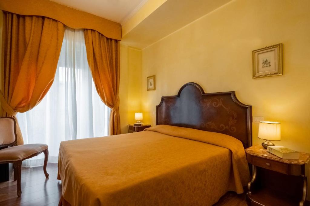 Postel nebo postele na pokoji v ubytování Hotel Rigel