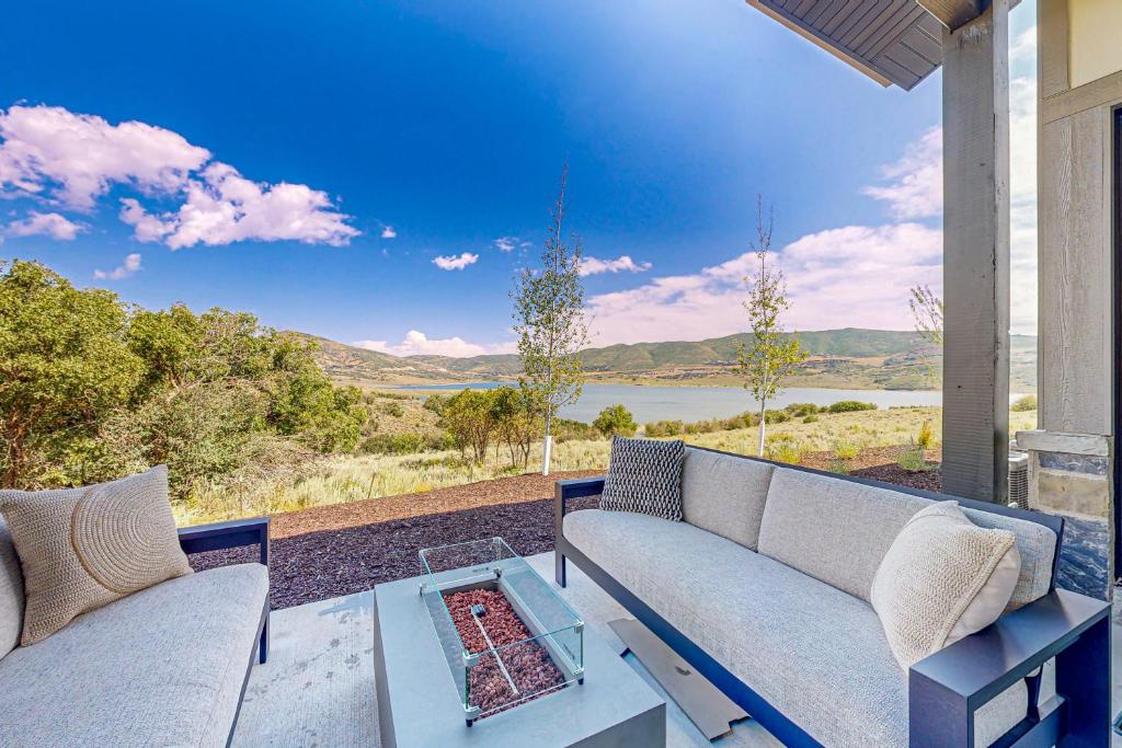 a living room with a couch and a table at Lakeside Luxury in Heber City