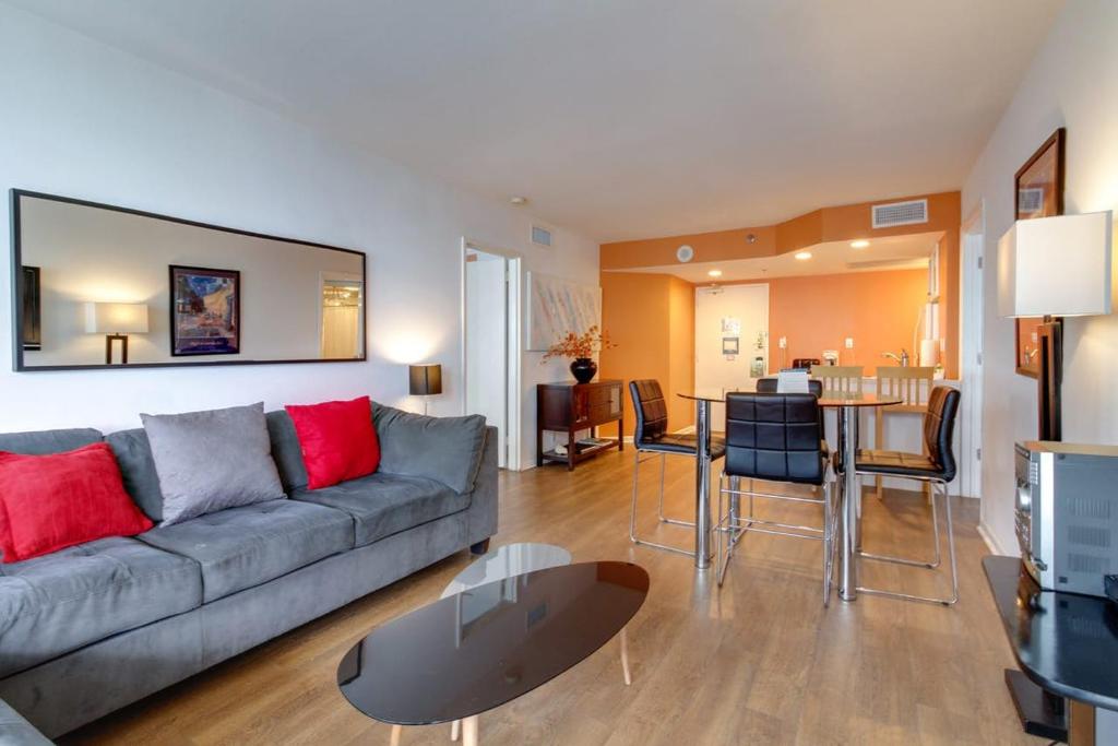 a living room with a couch and a table at Alexander 1209 Beachfront condo with 2 pools , beach access, sauna, stores in Miami Beach