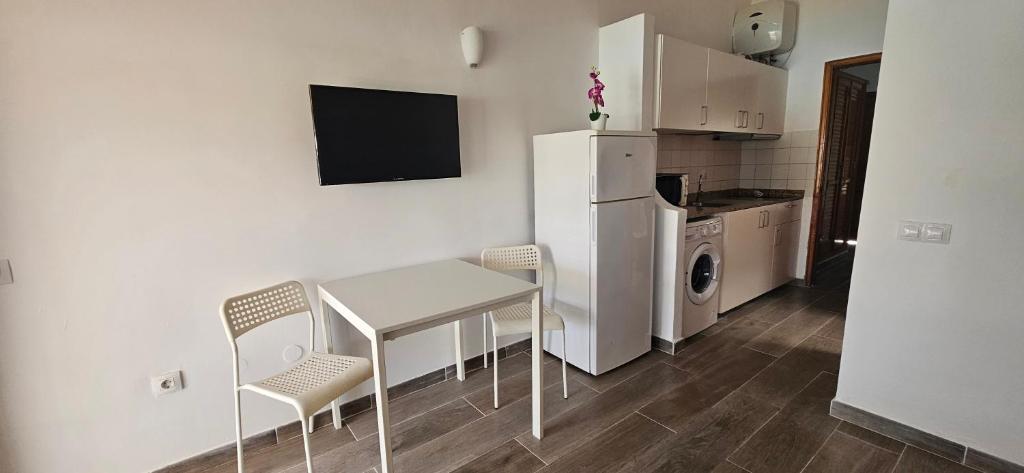 Kuchyňa alebo kuchynka v ubytovaní Marlenghi Apartments 70