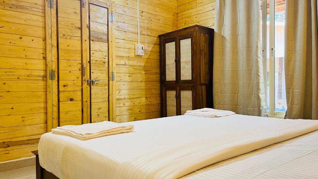 Postel nebo postele na pokoji v ubytování The Mild Goa