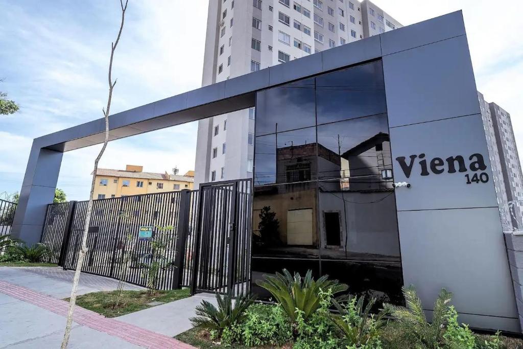 a mirrored building with the words yercca at Apto Completo BH ARENA MRV - Ar Condicionado e Estacionamento in Belo Horizonte