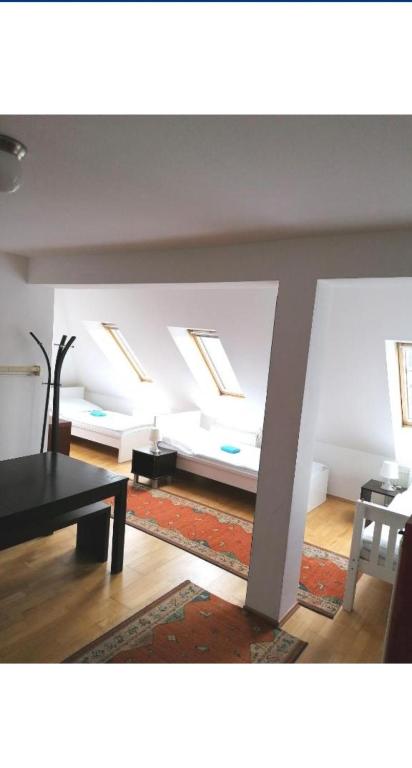 Postel nebo postele na pokoji v ubytování Vienna Rooms Nr 14