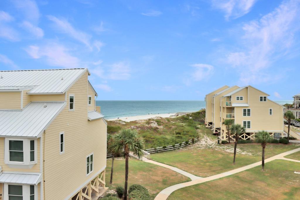 a view of a house and the beach at Sea Cliff K-68 Aqua La Vista Baby! by Pristine Properties Vacation Rentals in Oak Grove