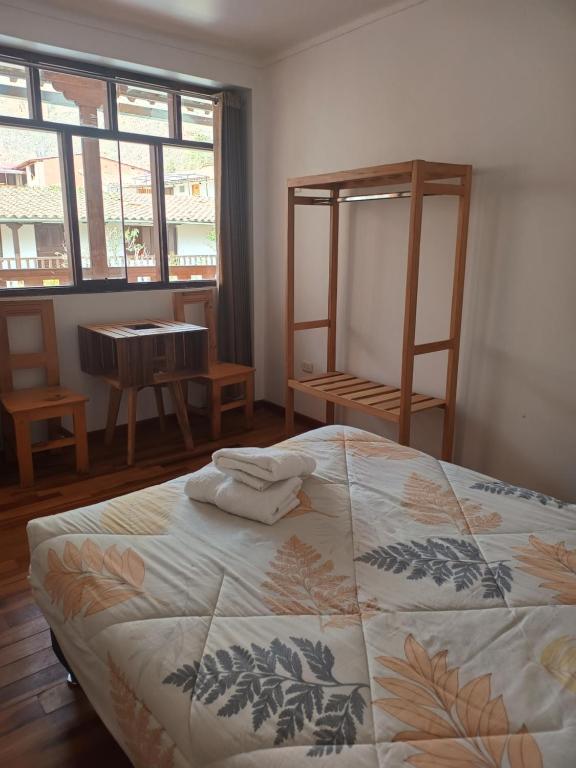Postel nebo postele na pokoji v ubytování Sequeiros Garden