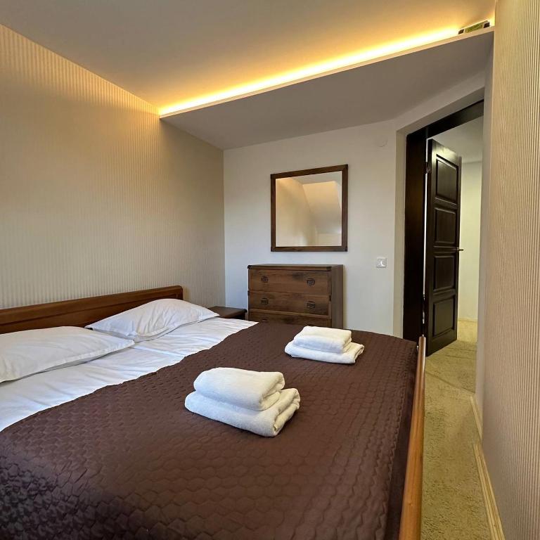 Postel nebo postele na pokoji v ubytování GORGANY resort & SPA