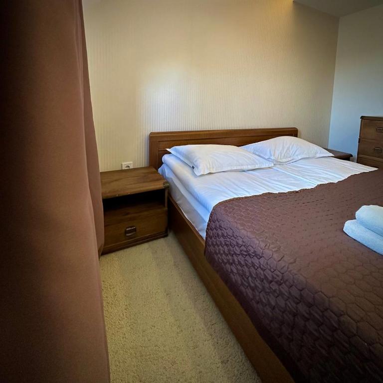 Postel nebo postele na pokoji v ubytování GORGANY resort & SPA